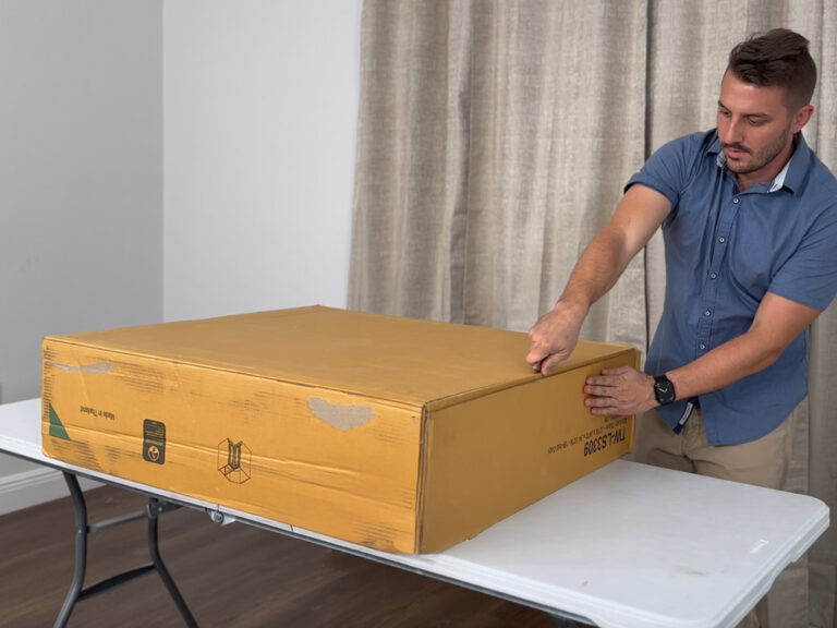 Man assembling RTA kitchen cabinet from Simply Cabinets.